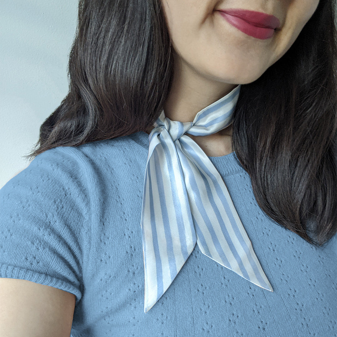 Woman wearing a silk neck tie 